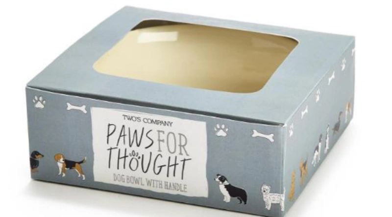 Boxed dog bowl with cute dog illustrations.
