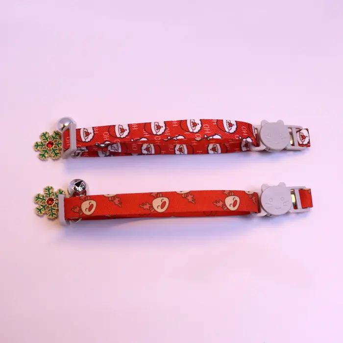 Red Christmas-themed cat collars with bells.