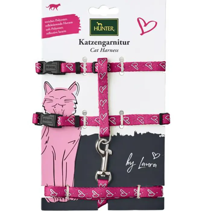 Pink cat harness with heart design.
