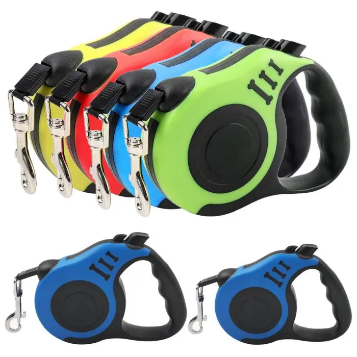 Colorful retractable dog leashes with handles.
