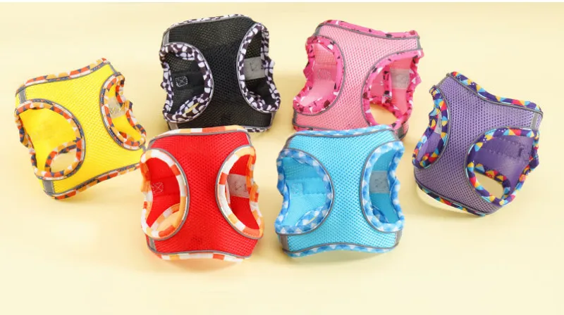 Colorful mesh pet harnesses on display.